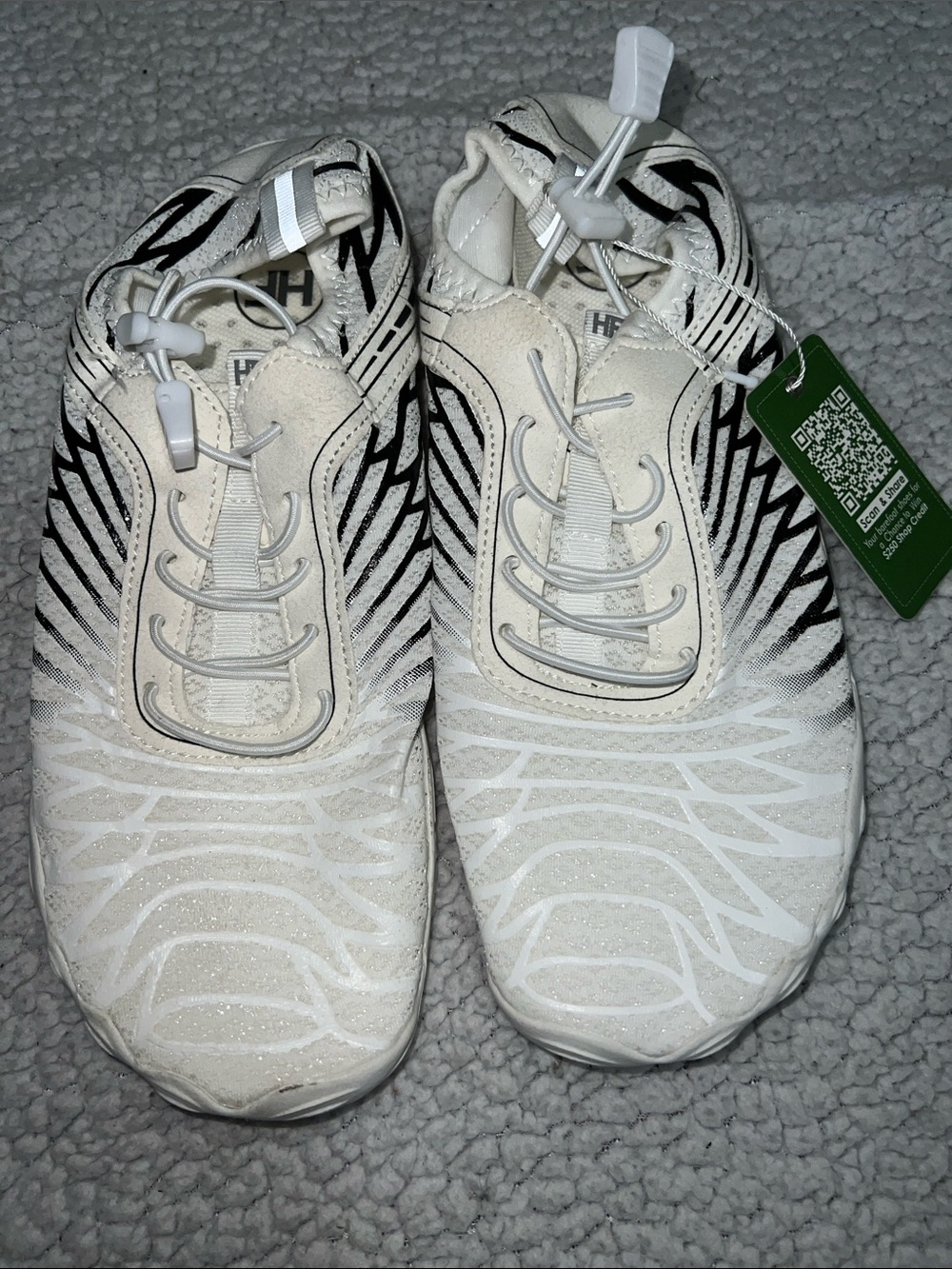 Women’s White Athletic Slip-On Sneakers with Black Accent Pattern